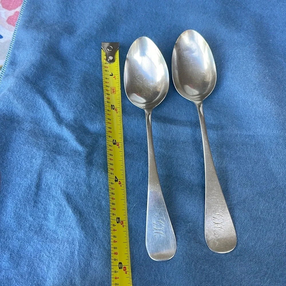 Set of 2 antique spoons , stamped lion and sterling